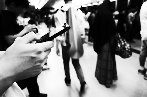 Monochrome image of a social media campaign in action on multiple devices.