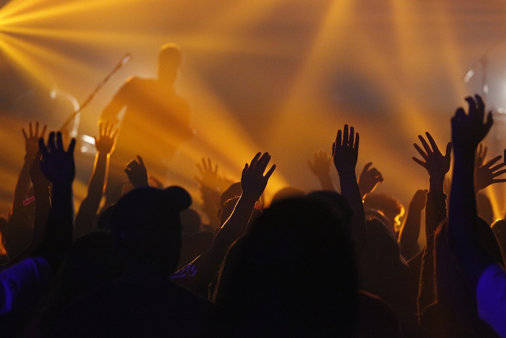 people jamming while man singing on stage