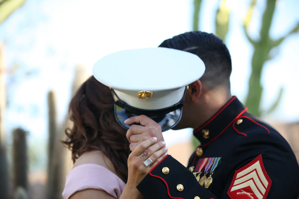 Two service members outside a house