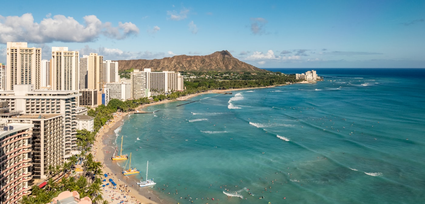Aerial view of Waikiki Beach and the Honolulu shoreline with Diamond Head in the distance