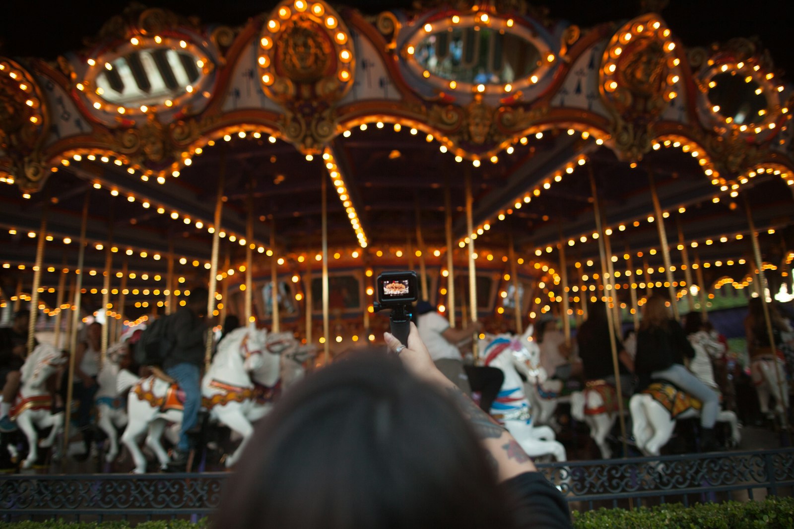 Canon EF 24mm F1.4L II USM sample photo. People riding merry go photography