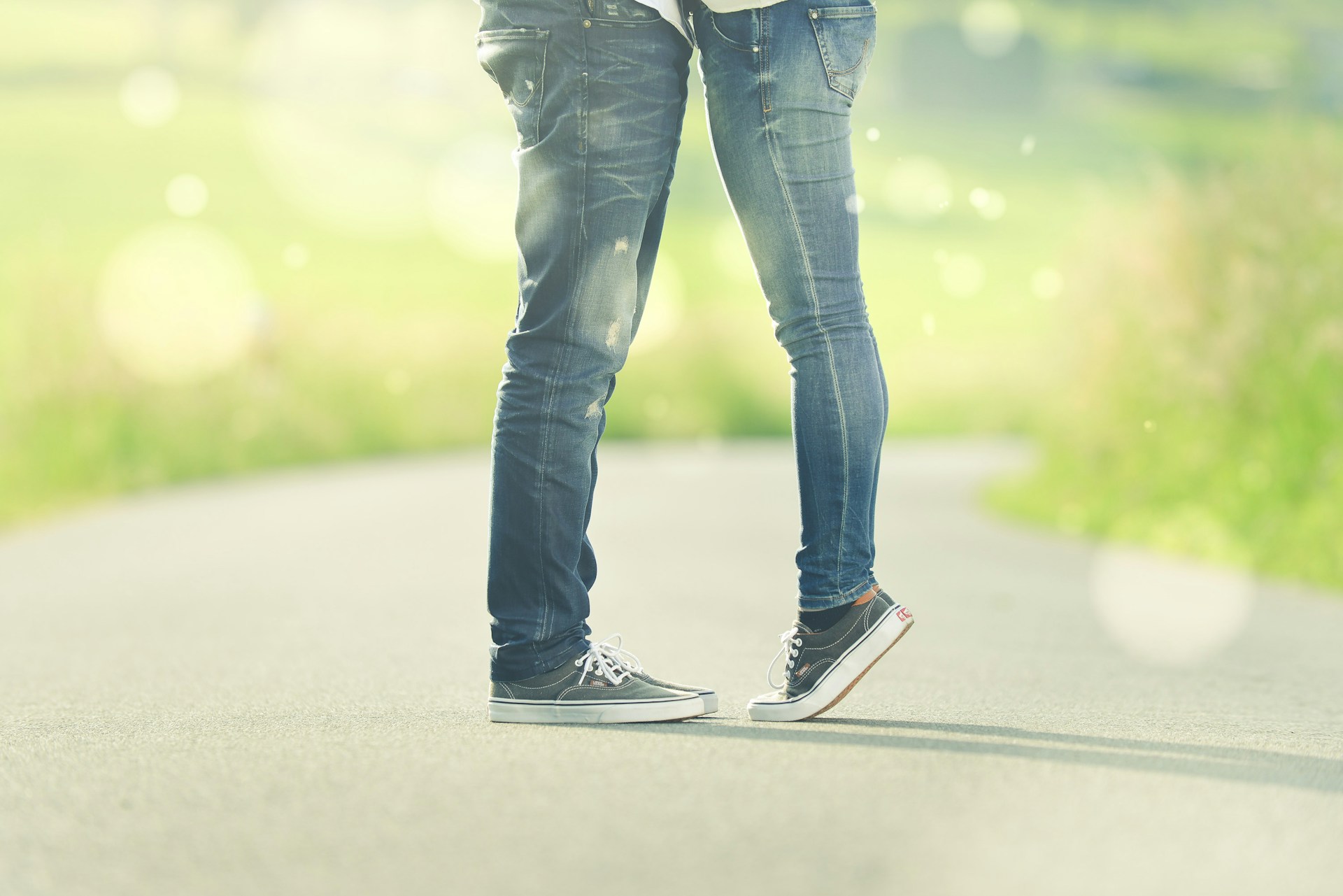 person tip-toeing in front of other person
