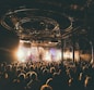 people attending concert inside dark room