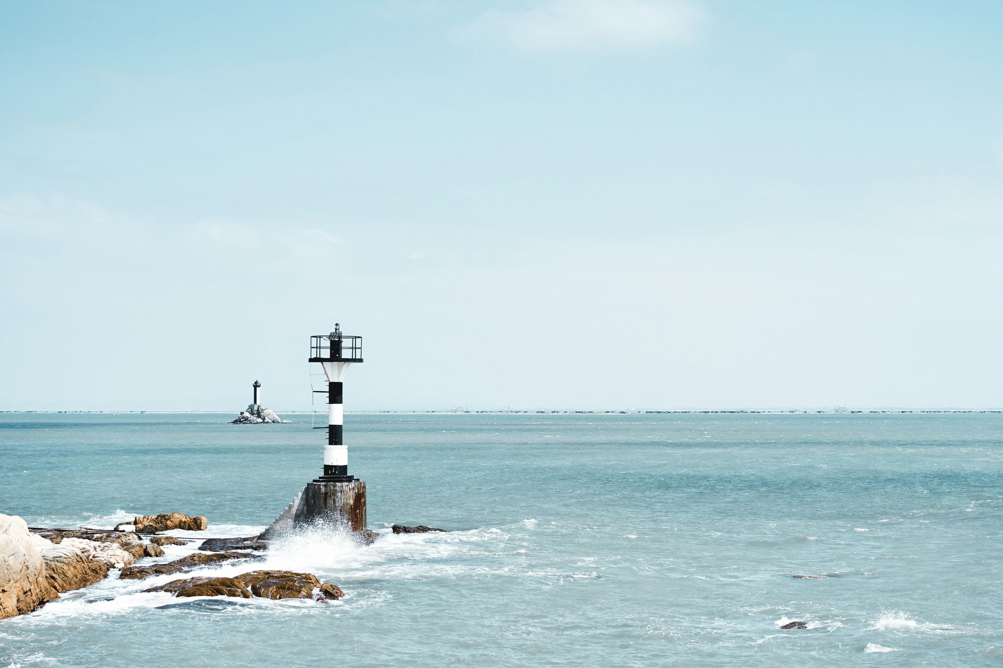 photography of white and black lighthouse