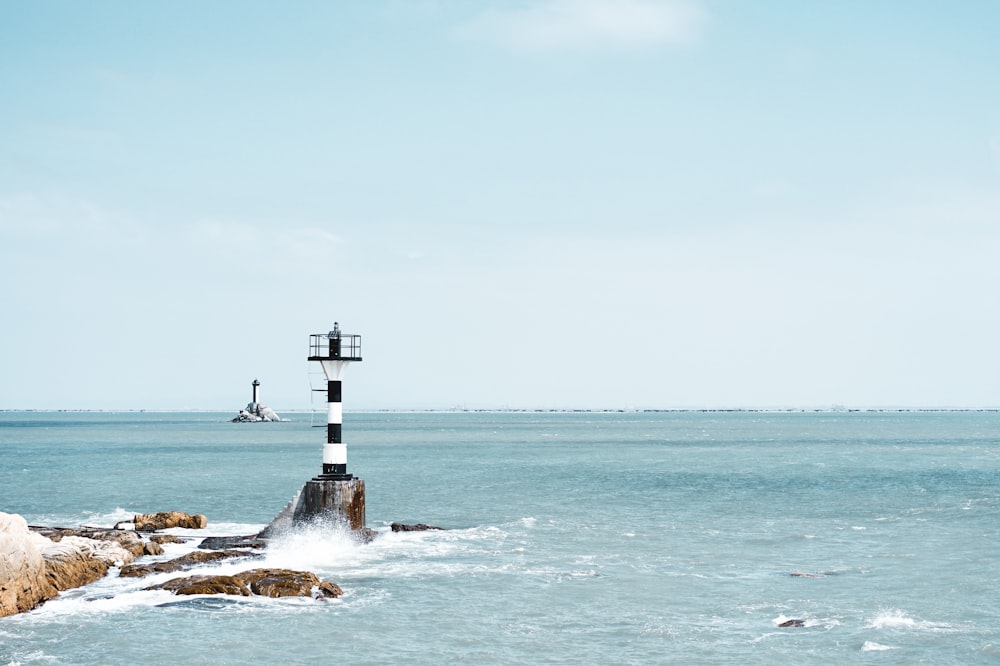 photography of white and black lighthouse