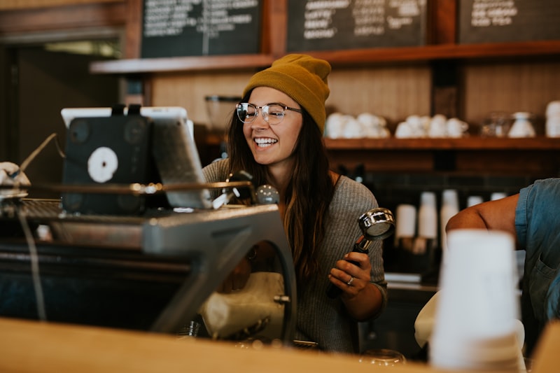 Barista carefully crafting a latte at Joe's Coffee Shop