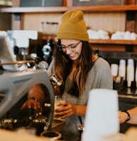 woman holding clear drinking glass