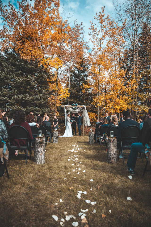 A couple saying their vows in an autumn forest