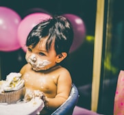 boy sitting on blue highchair