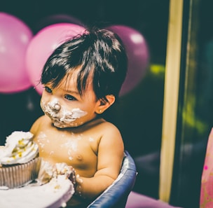 boy sitting on blue highchair