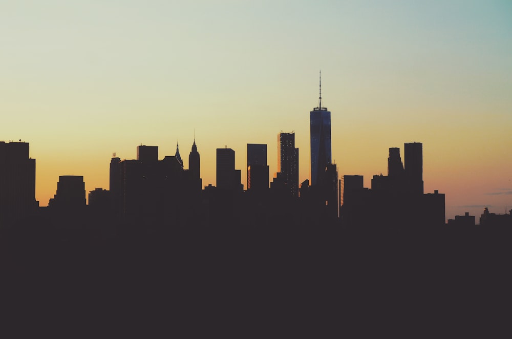 silhouette photography of high-rise buildings