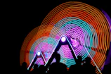The team forming a synchronized circle formation mid-spin during a radiant performance