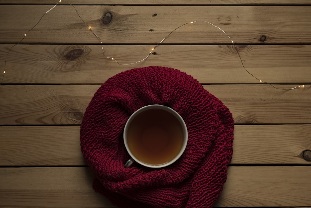 mug on red knit apparel