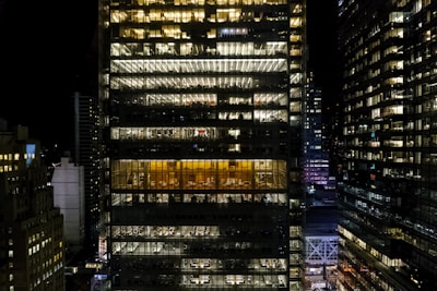 Night view of a well-lit office building in the city