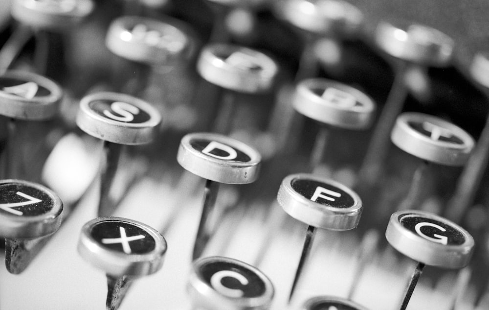 silver typewriter in shallow focus photography