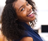 woman looking back while smiling