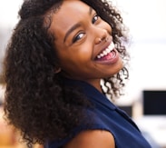 woman looking back while smiling