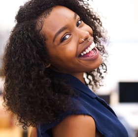 woman looking back while smiling