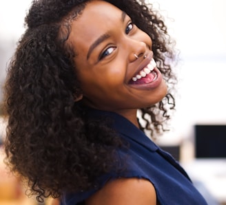 woman looking back while smiling