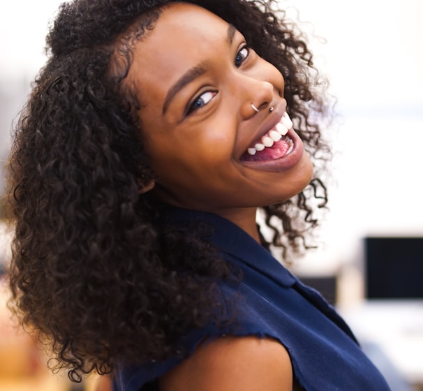 woman looking back while smiling