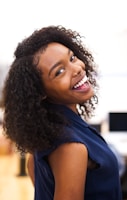 woman looking back while smiling