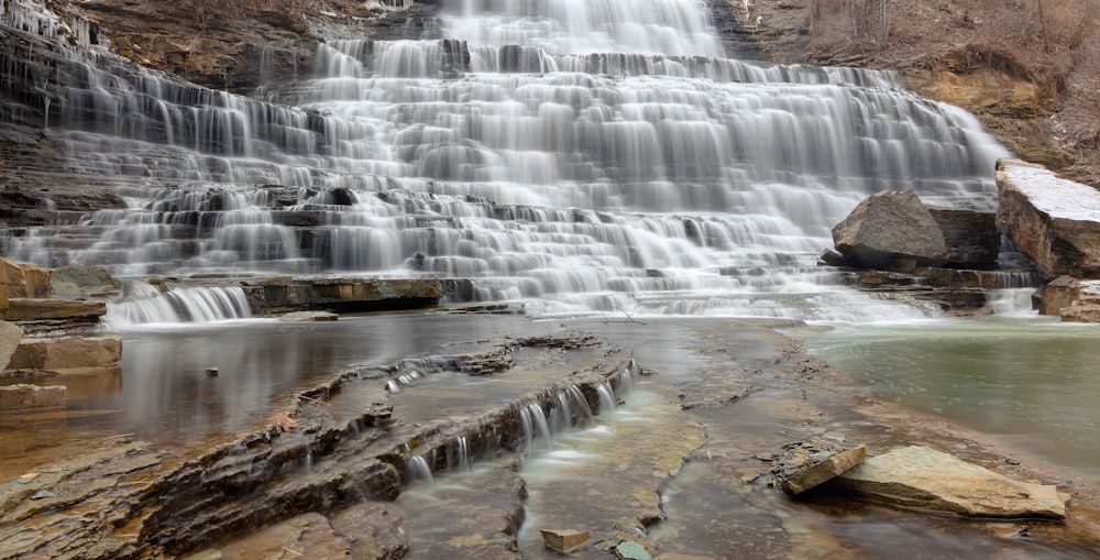 time-lapse photo of layered waterfalls