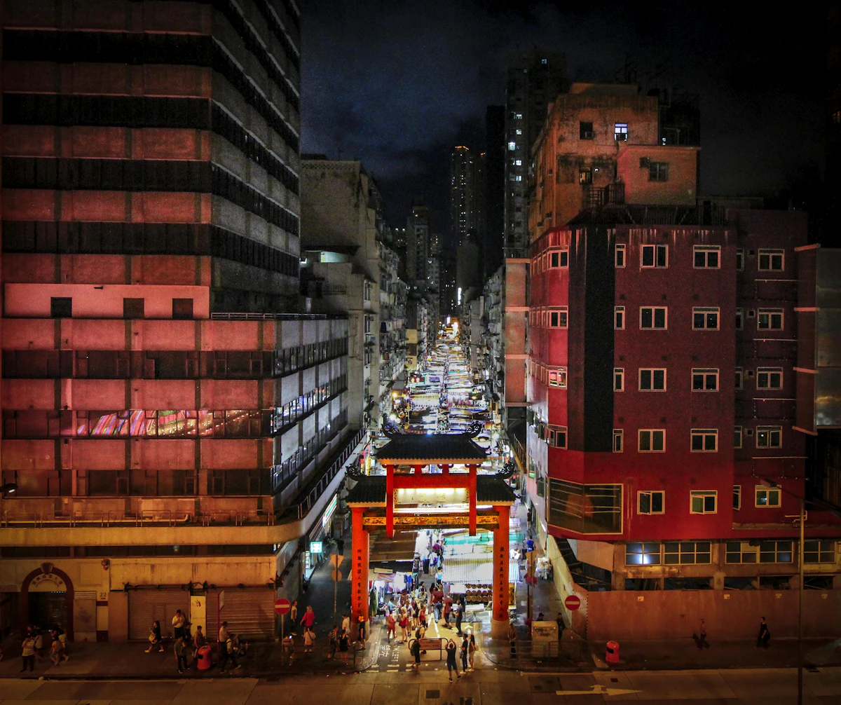 Neon-lit stalls of Temple Street Night Market in Kowloon