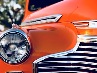 Before and after shots of a restored classic car with polished chrome details