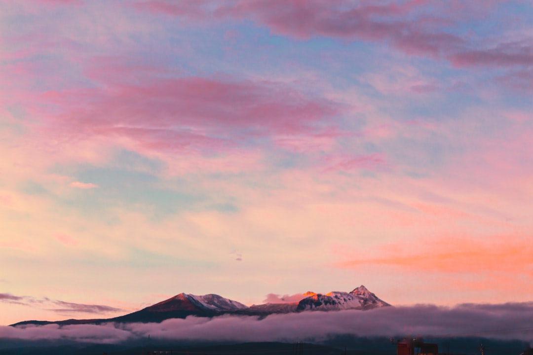 aerial photography of mountain under clouds during golden hour, Sunset