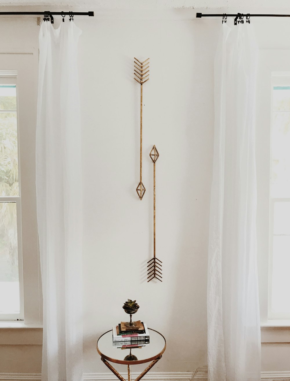 brown wooden cross on white wall