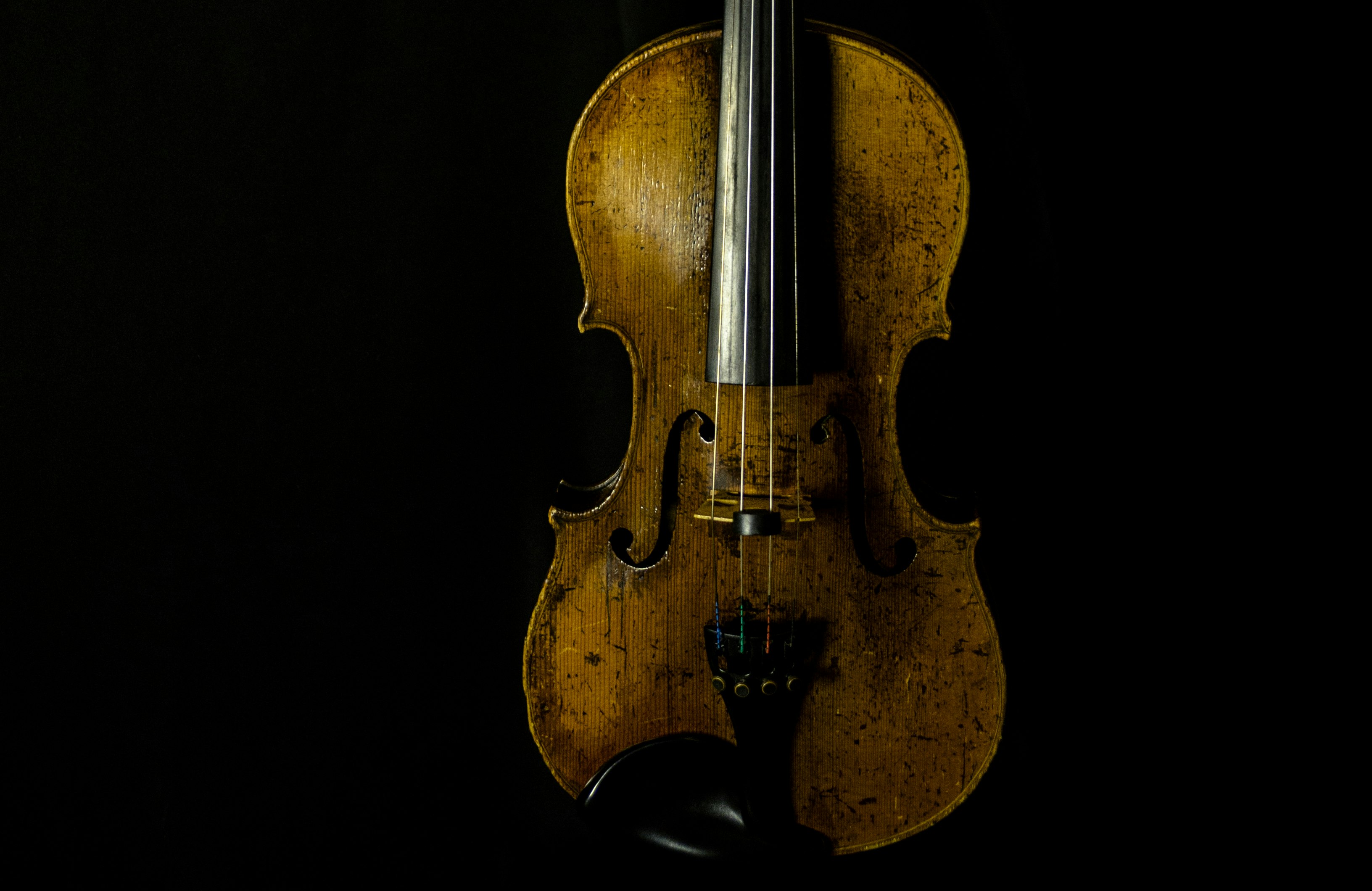 brown violin with black background