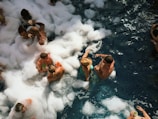 people in water with ice