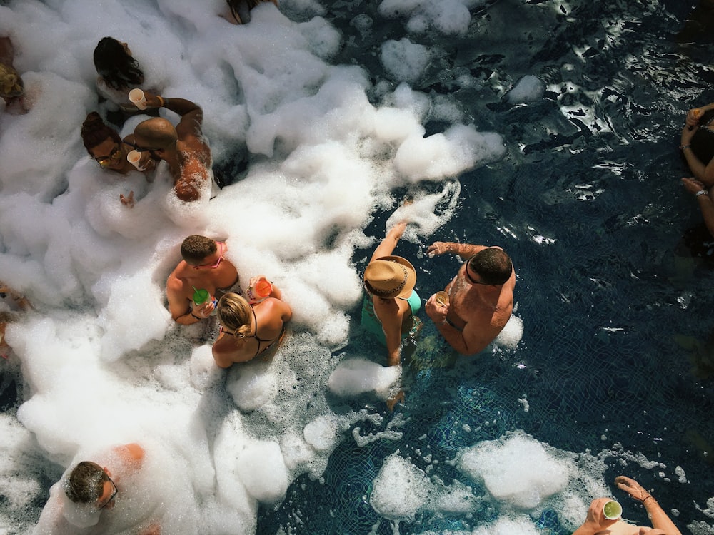 people in water with ice