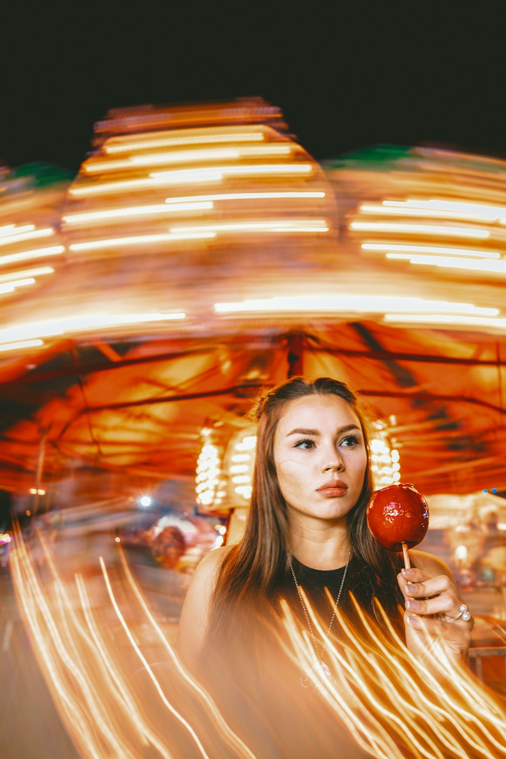 woman holding pomegranate candy