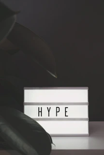 Close-up of hypn's black background logo with white lettering displayed prominently in a chic interior setting.