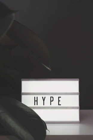 Close-up of hypn's black background logo with white lettering displayed prominently in a chic interior setting.