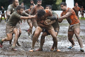 a group of men playing a game of rugby