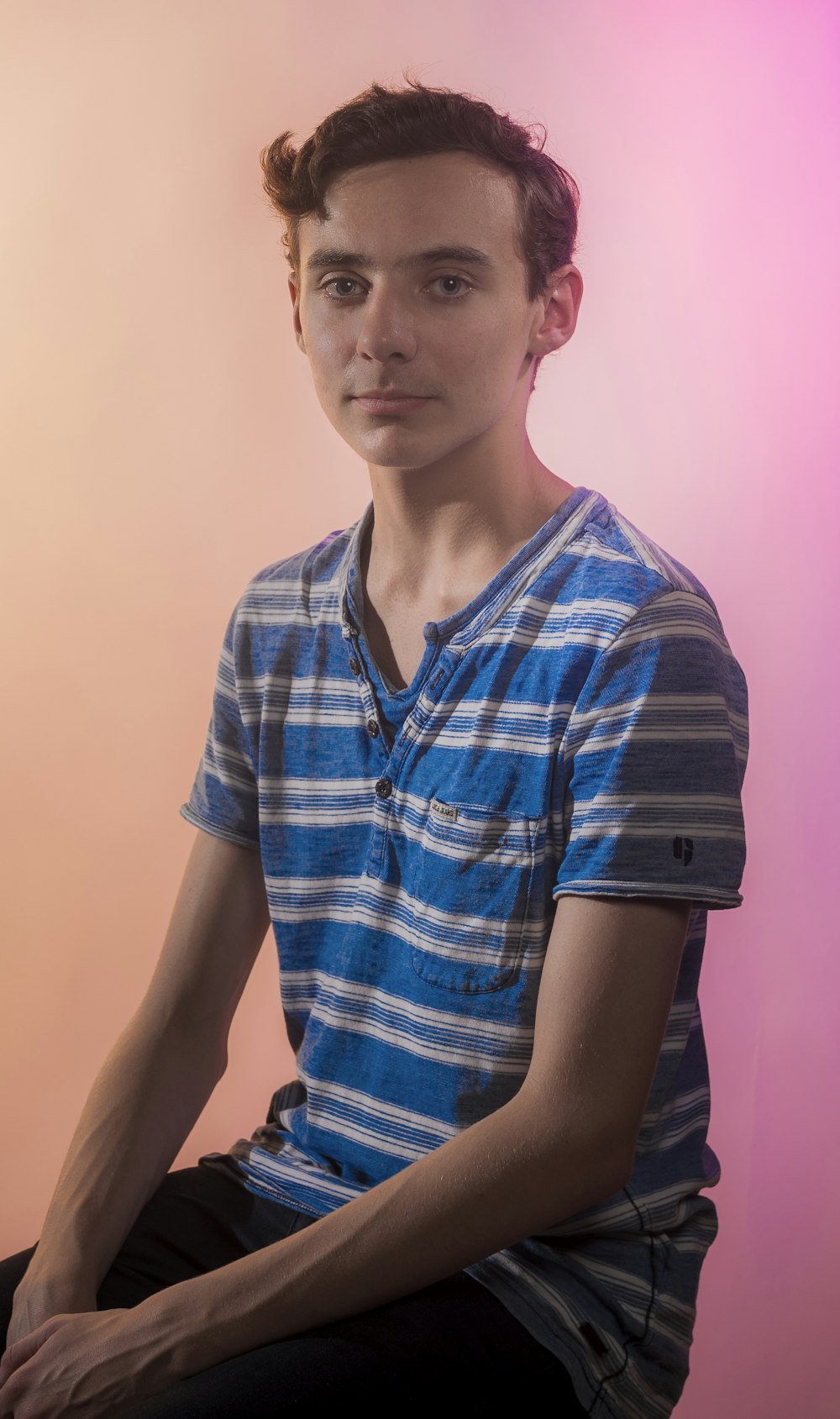 man in blue and white striped shirt