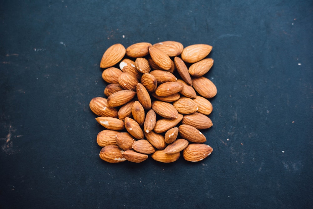 brown nuts on black surface