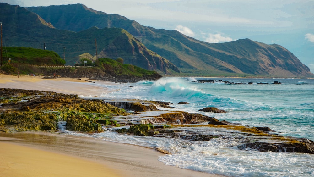 sea waves on brown rocky cliff