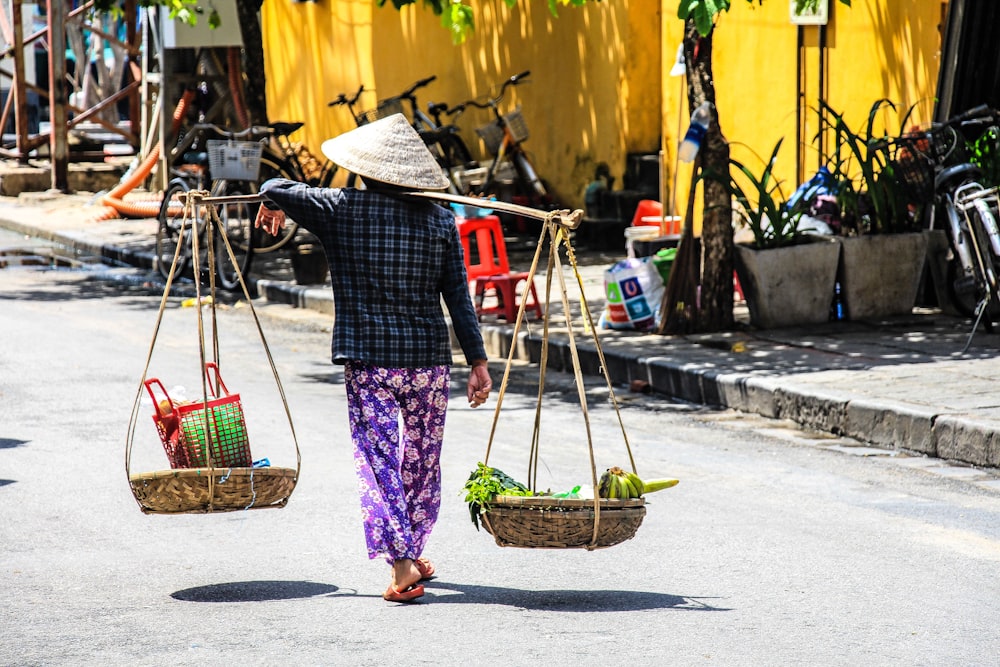 person carrying vegetables with basket