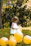 girl wearing white sleeveless dress beside balloons