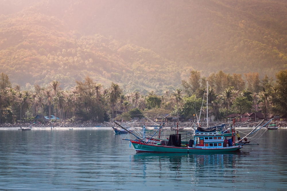 gray fishing boat over body of water