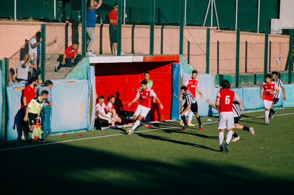 group of men playing soccer