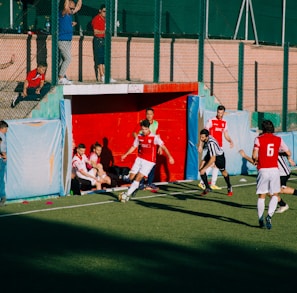 group of men playing soccer