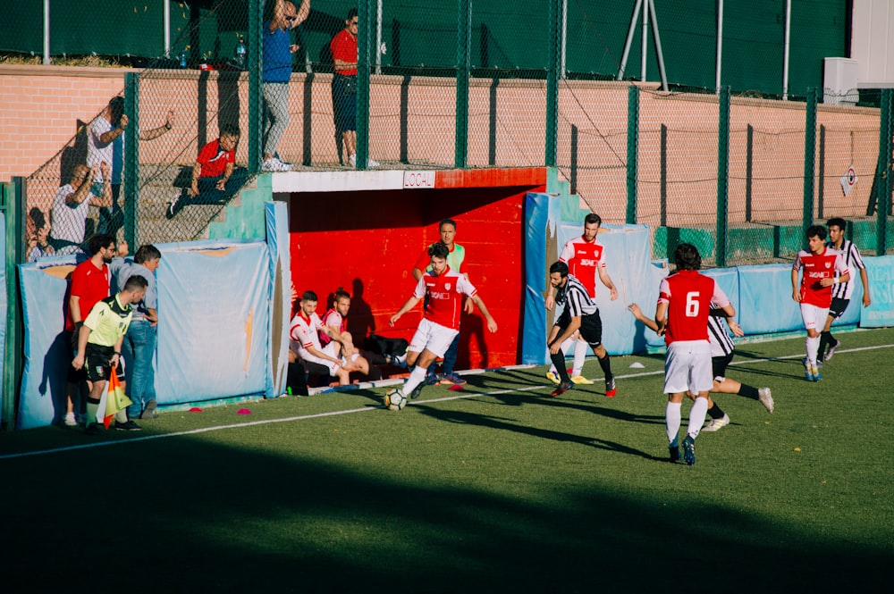 group of men playing soccer