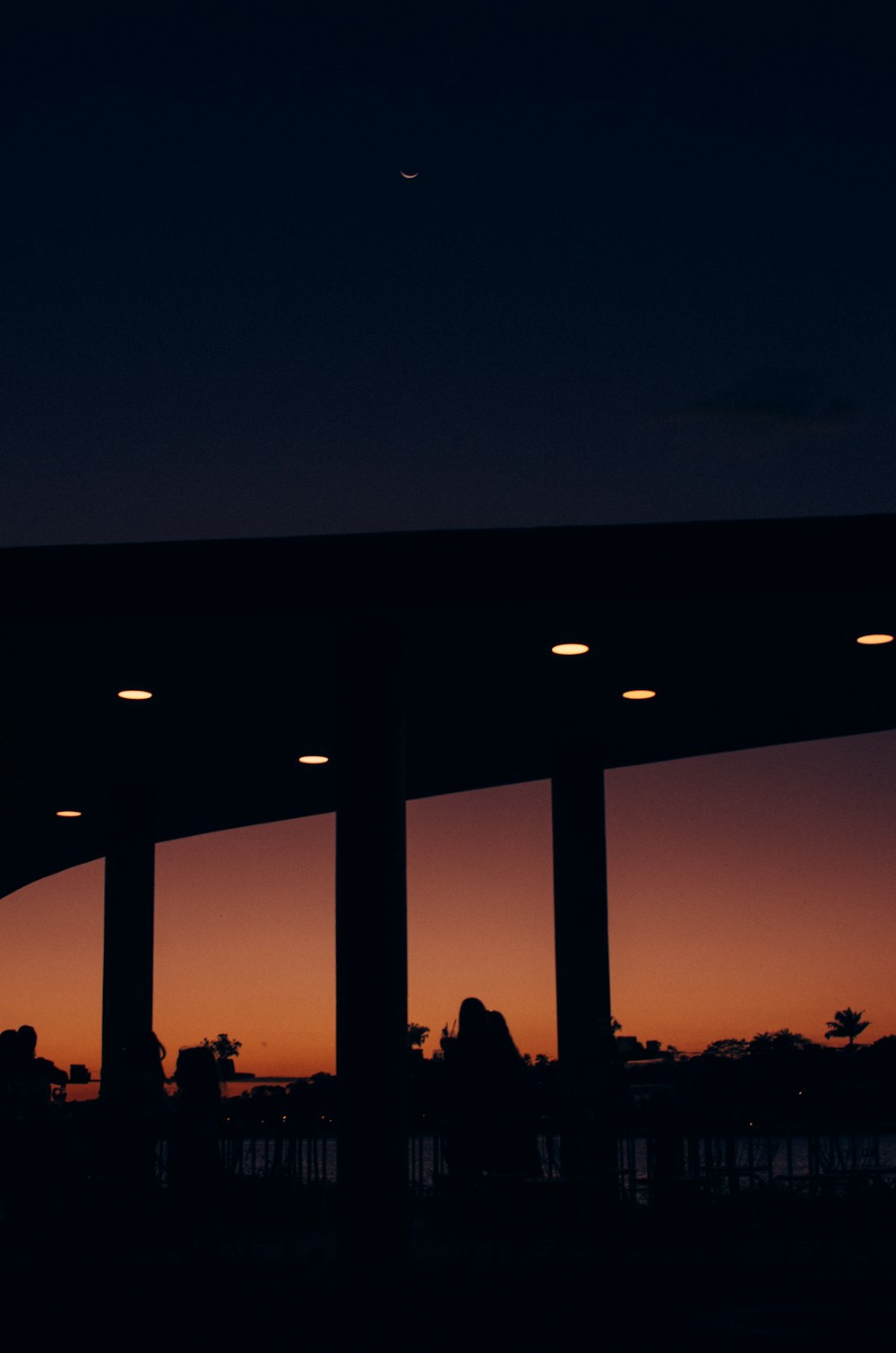 silhouette of bridge during golden hour