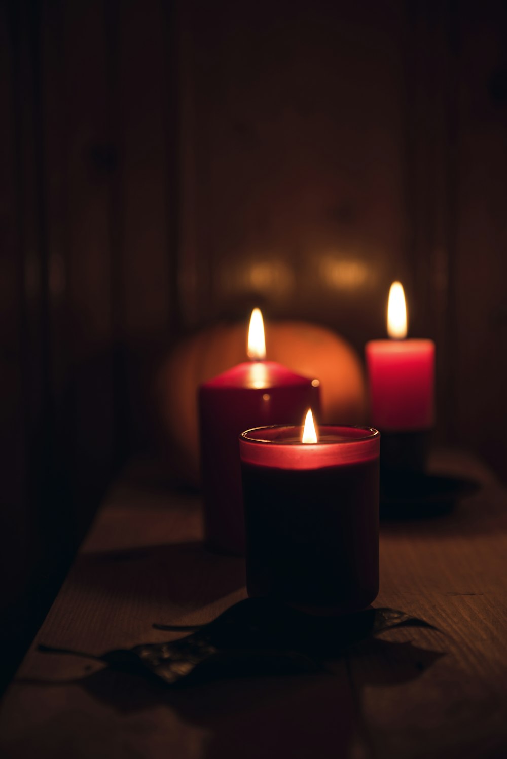 candles with fire during nighttime