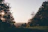 A couple enjoying a serene sunset view from the garden terrace of Phulchokivista.