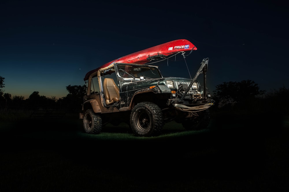 black off-road vehicle near trees